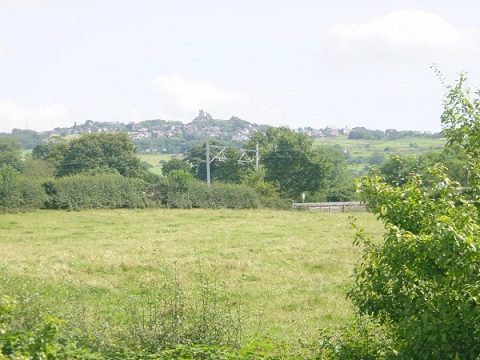 Photo of Mow Cop Castle across fields